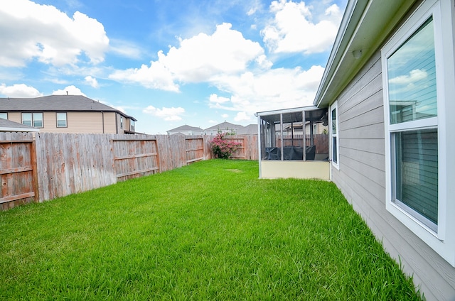 view of yard featuring a sunroom