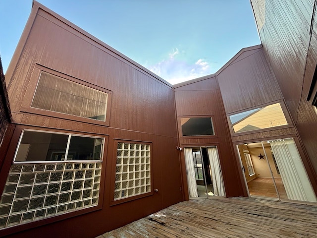 back of property featuring a wooden deck