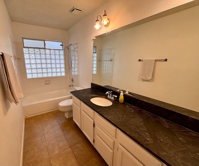 full bathroom with vanity, a textured ceiling, shower / bath combination, tile patterned flooring, and toilet