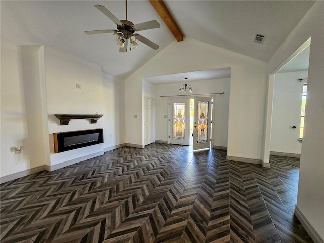 unfurnished living room with ceiling fan with notable chandelier, dark parquet flooring, beam ceiling, and high vaulted ceiling