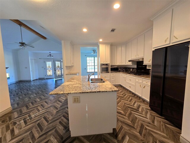 kitchen with white cabinetry, sink, dark parquet flooring, and black appliances