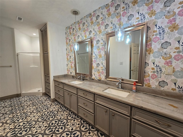 bathroom featuring vanity and a shower