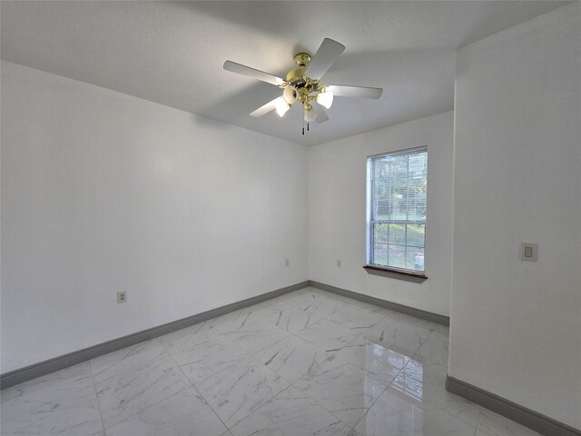 unfurnished room featuring ceiling fan