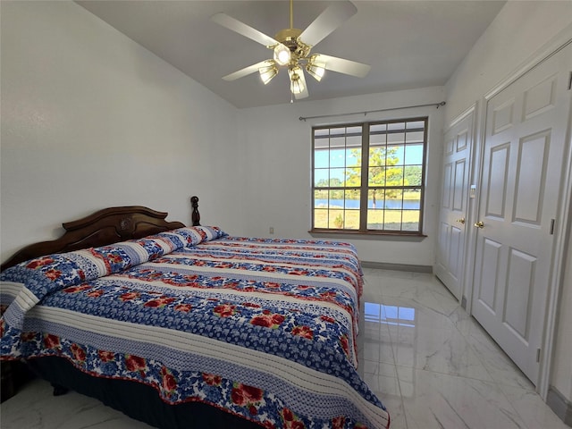 bedroom with lofted ceiling and ceiling fan