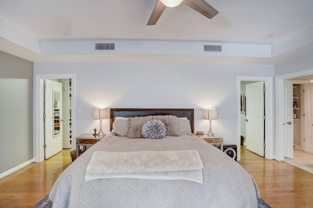 bedroom with ceiling fan and light hardwood / wood-style flooring