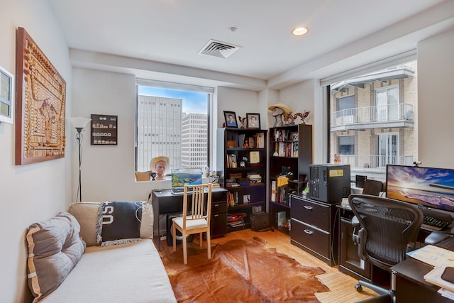 office space with hardwood / wood-style flooring