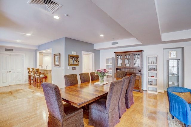 dining area with light hardwood / wood-style flooring