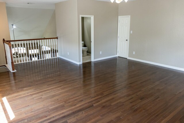 spare room with dark wood-type flooring