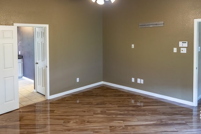 spare room featuring baseboards