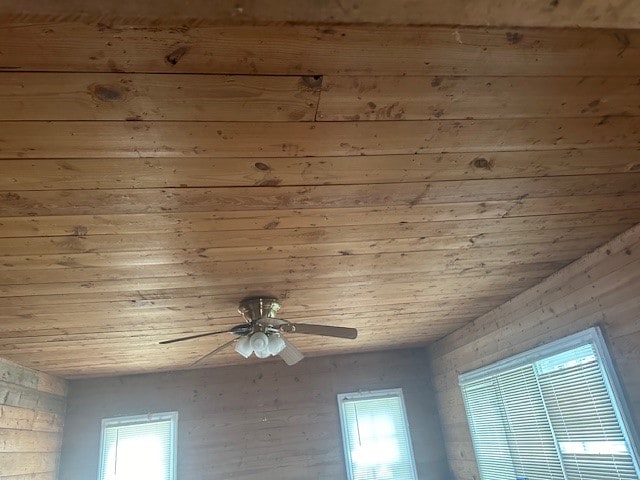 room details with ceiling fan and wooden ceiling