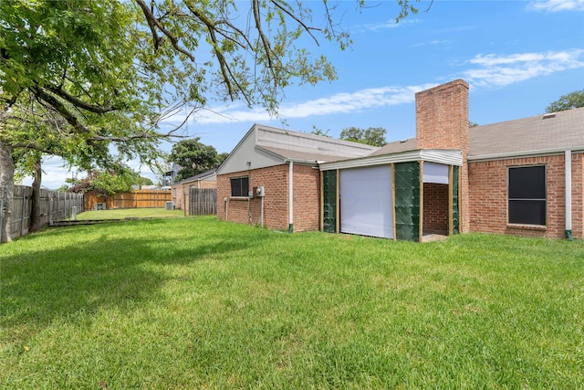 rear view of house with a lawn