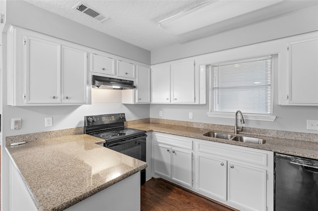 kitchen with a textured ceiling, dark wood-type flooring, sink, white cabinets, and black appliances