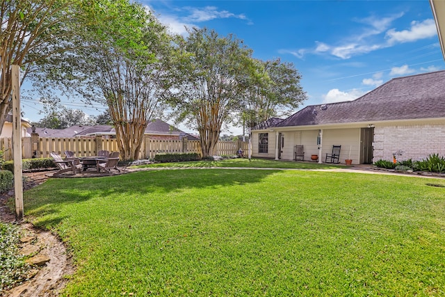 view of yard with a patio and a fire pit