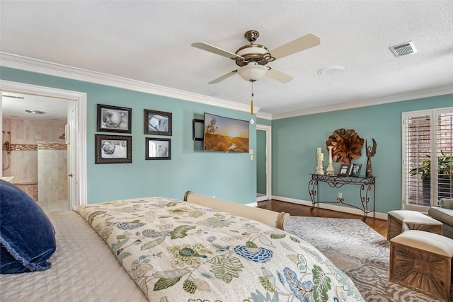 bedroom featuring light hardwood / wood-style flooring, crown molding, a textured ceiling, ensuite bathroom, and ceiling fan