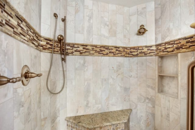 room details featuring tiled shower