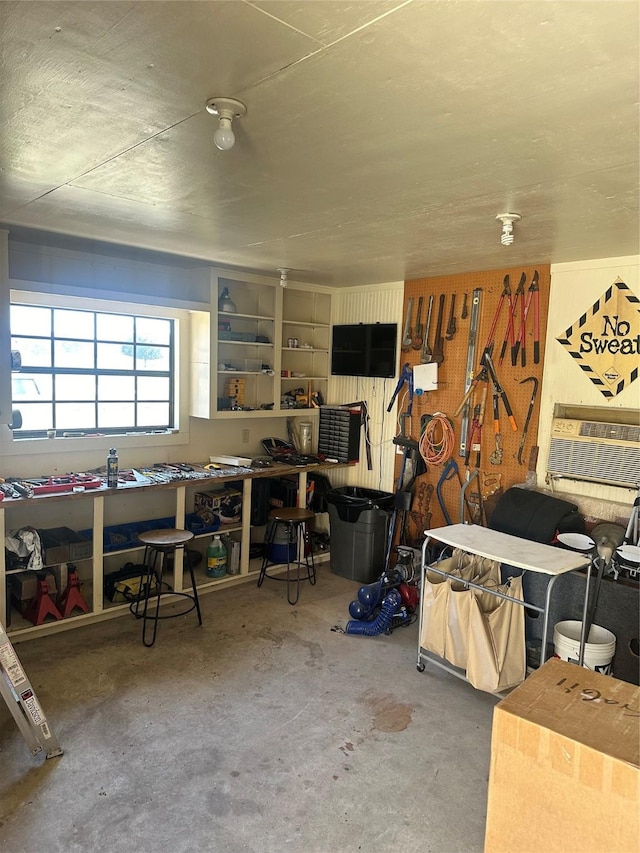611 S Cleveland St, Dayton, TX 77535 - interior space with a workshop area, cooling unit, and unfinished concrete flooring