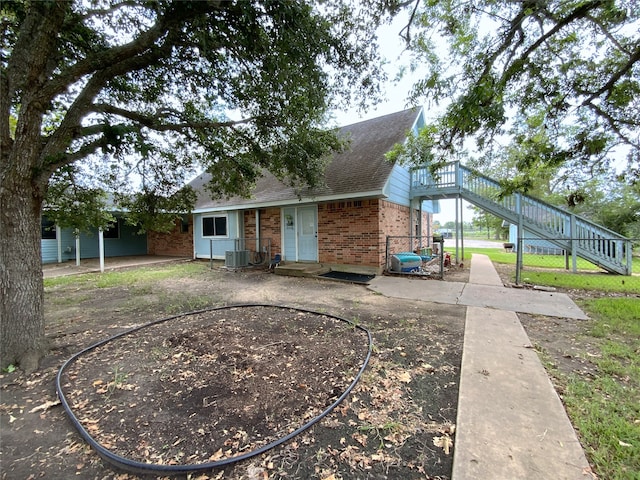 exterior space with central air condition unit