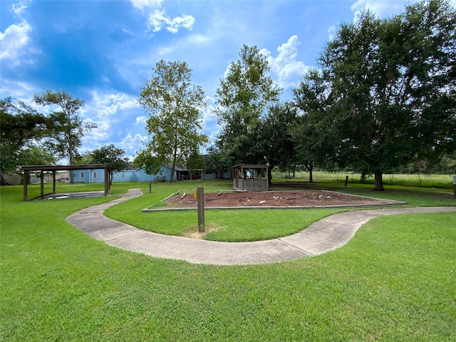 view of community featuring a lawn