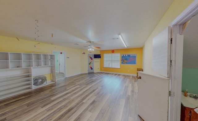 interior space featuring light hardwood / wood-style flooring and ceiling fan