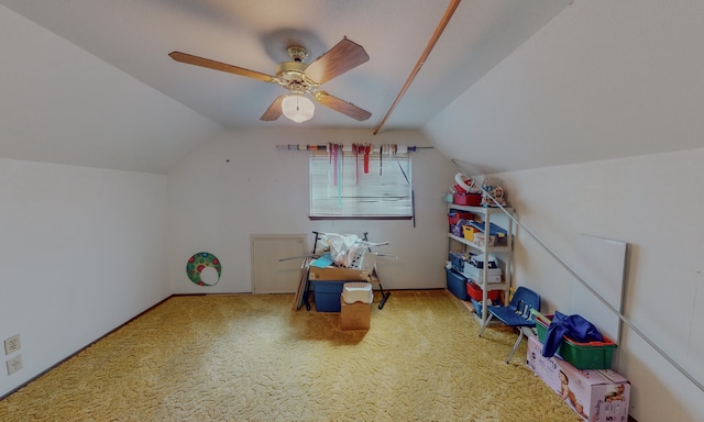 rec room featuring ceiling fan, vaulted ceiling, and light colored carpet