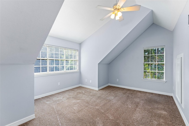 bonus room with light carpet, ceiling fan, and lofted ceiling