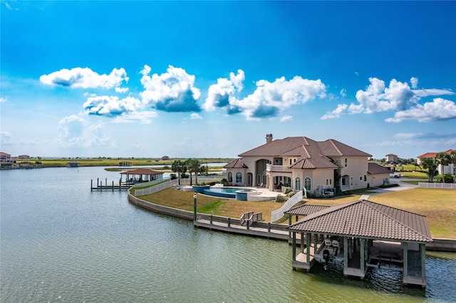 dock area with a yard and a water view