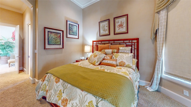 bedroom with ornamental molding and light carpet