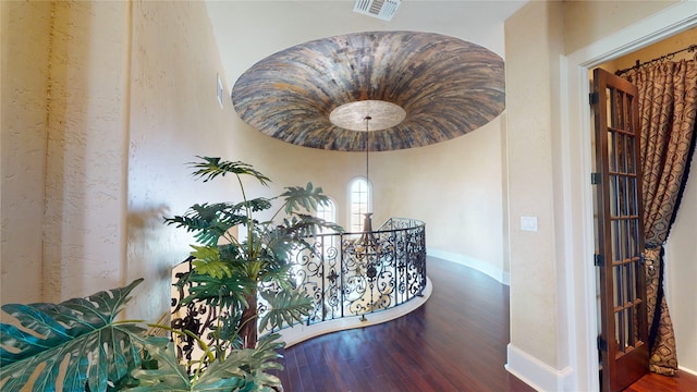 corridor with hardwood / wood-style floors