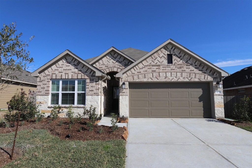 view of front of property with a garage