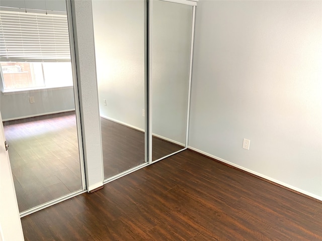 unfurnished bedroom featuring wood-type flooring