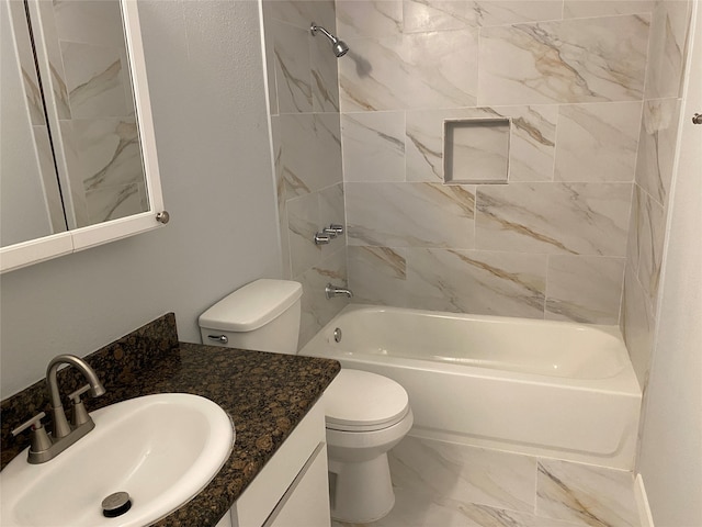 full bathroom featuring toilet, tiled shower / bath combo, and vanity