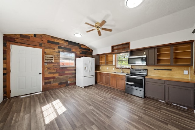 kitchen featuring dark wood-style floors, open shelves, ceiling fan, a sink, and appliances with stainless steel finishes