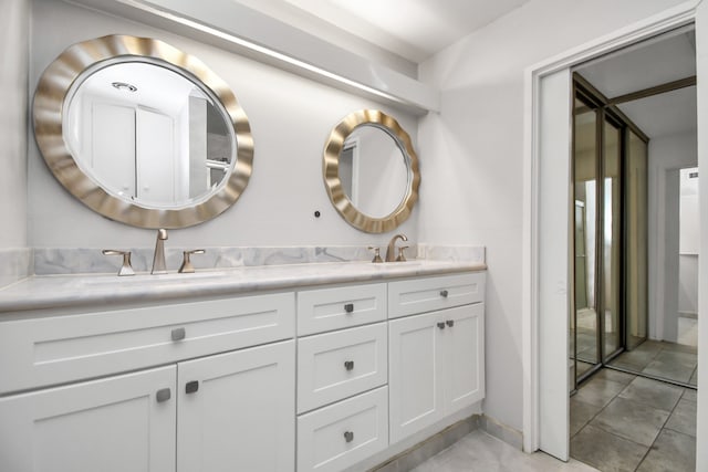 bathroom with vanity and tile patterned floors