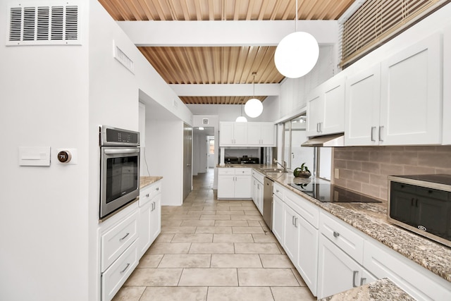 kitchen featuring backsplash, decorative light fixtures, wood ceiling, stainless steel appliances, and beam ceiling