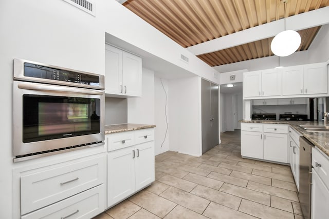 kitchen with wooden ceiling, stainless steel appliances, and white cabinets