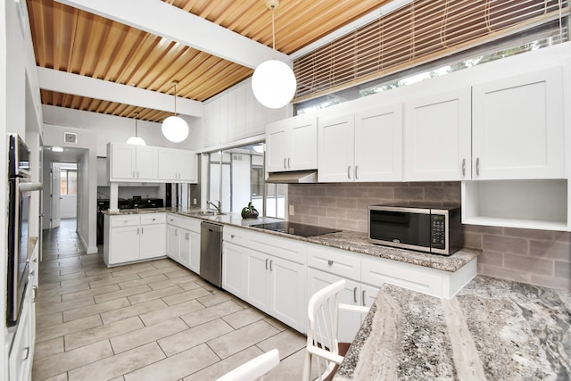 kitchen with hanging light fixtures, appliances with stainless steel finishes, wood ceiling, beamed ceiling, and tasteful backsplash