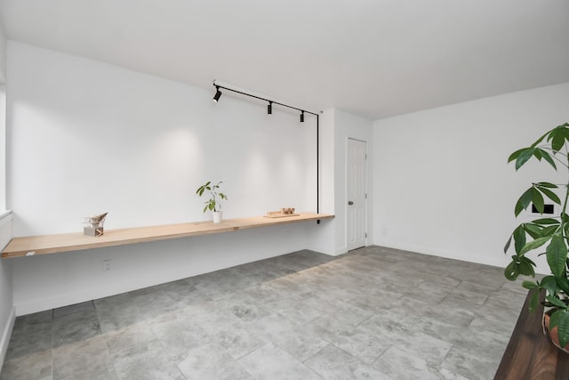 unfurnished office featuring light tile patterned flooring