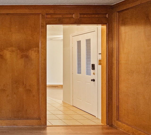 corridor with light tile patterned flooring