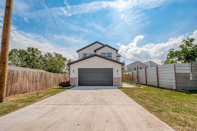 garage featuring a lawn