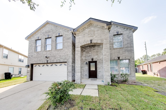 view of front of house with a front lawn and a garage