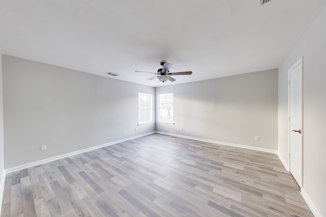 empty room featuring ceiling fan and light hardwood / wood-style floors