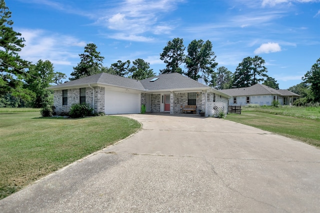 ranch-style house with a garage and a front yard