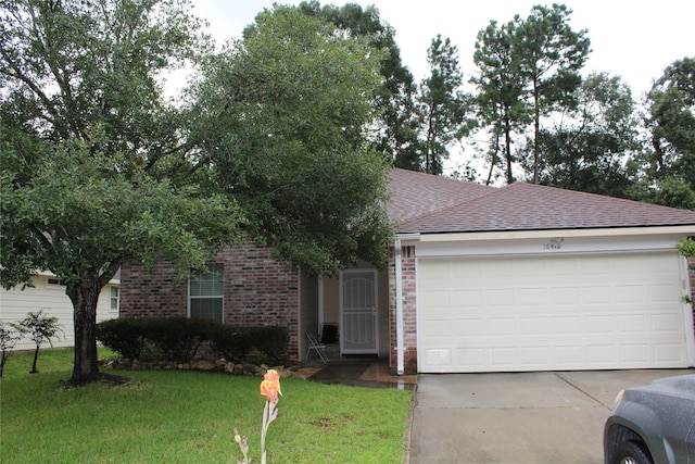 ranch-style home featuring a garage and a front yard