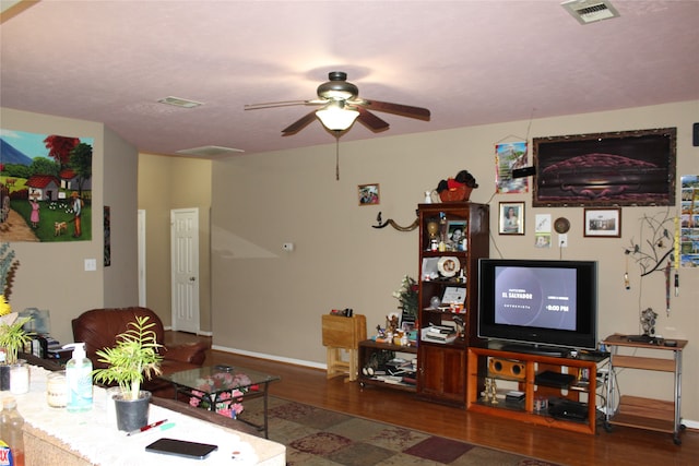 living room with ceiling fan and wood-type flooring