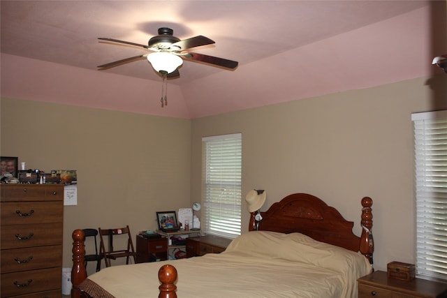 bedroom featuring ceiling fan and lofted ceiling