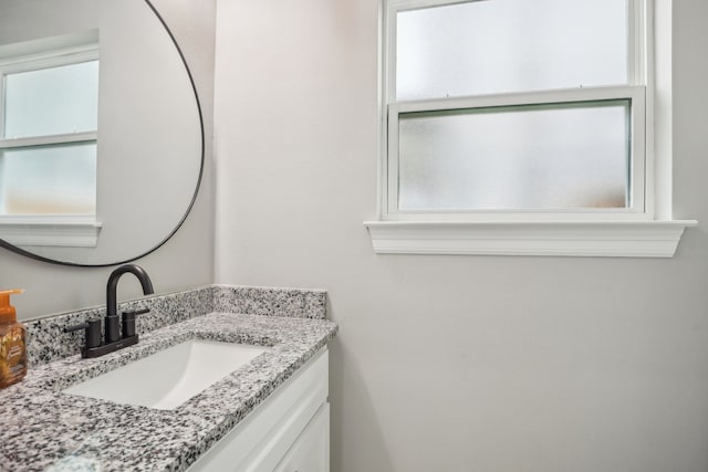 bathroom featuring vanity and plenty of natural light