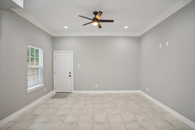 tiled empty room featuring crown molding and ceiling fan