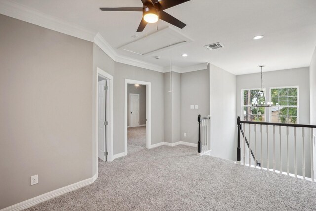 unfurnished room featuring crown molding, ceiling fan with notable chandelier, and light colored carpet