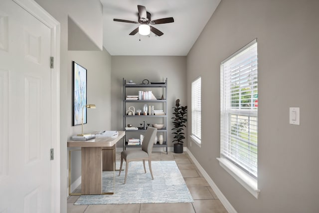 office area with ceiling fan and light tile patterned flooring