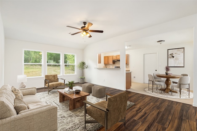 living room featuring ceiling fan and hardwood / wood-style flooring